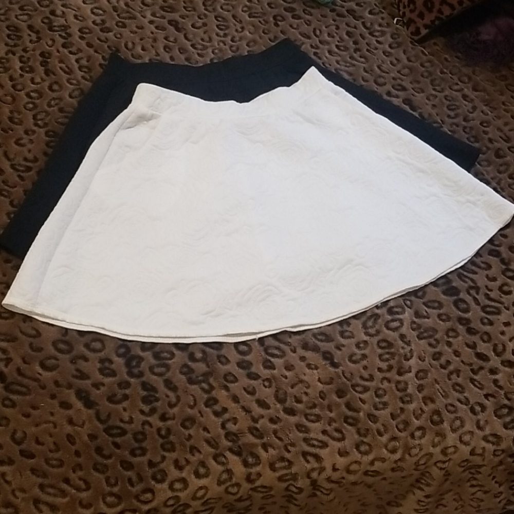Brand new black and white skirts